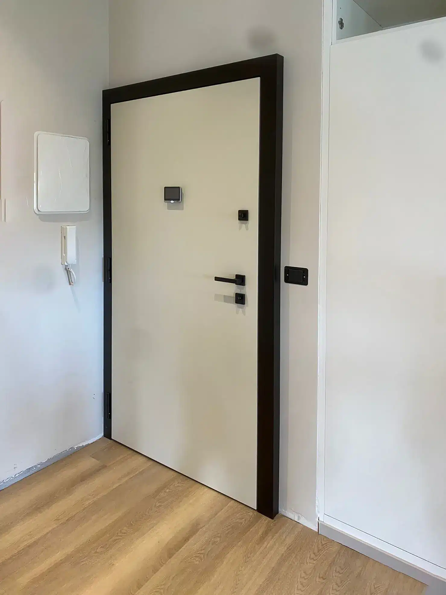 armoured door with black architrave trims