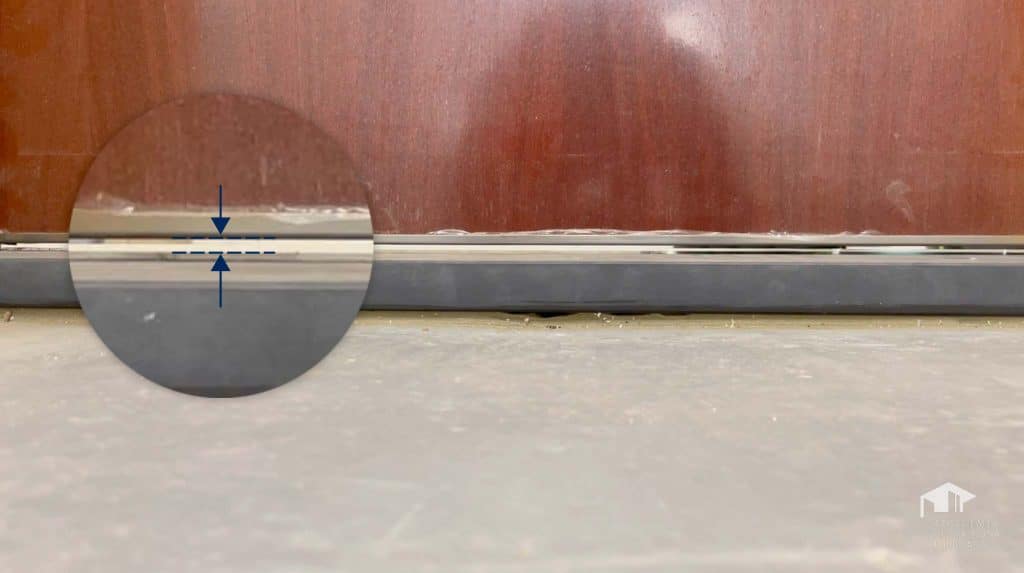 adjusting the draught excluder on an armoured door