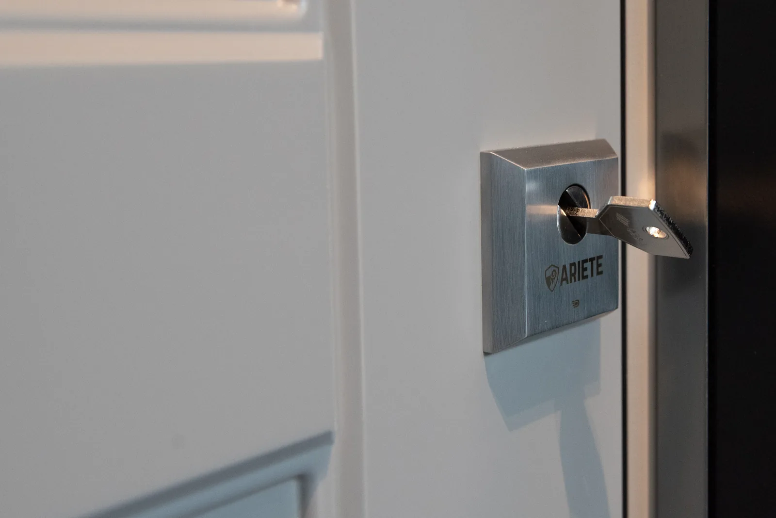 square defender with chamfered corners on an armoured door