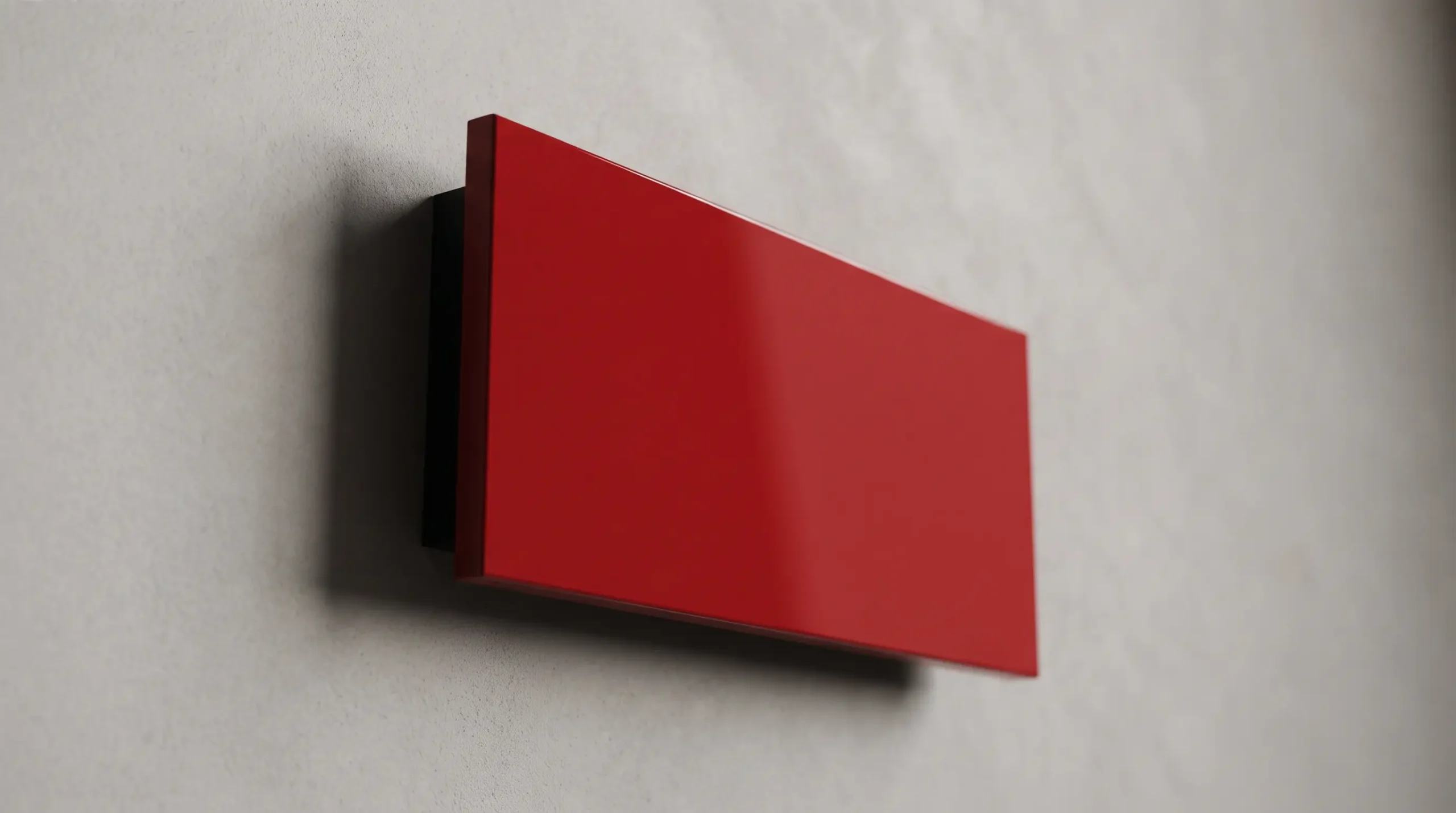 Red armoured door panel against a grey background